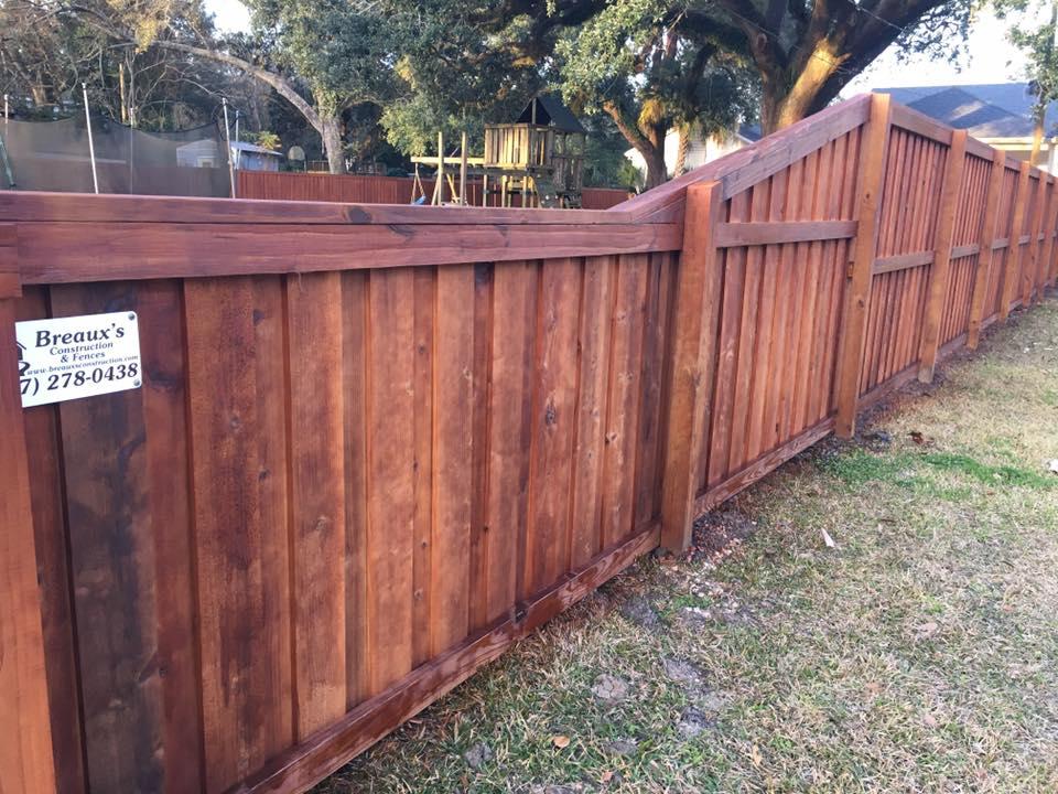 Breaux's Fence specialty T-Bro 3D style fence with natural pecan stain